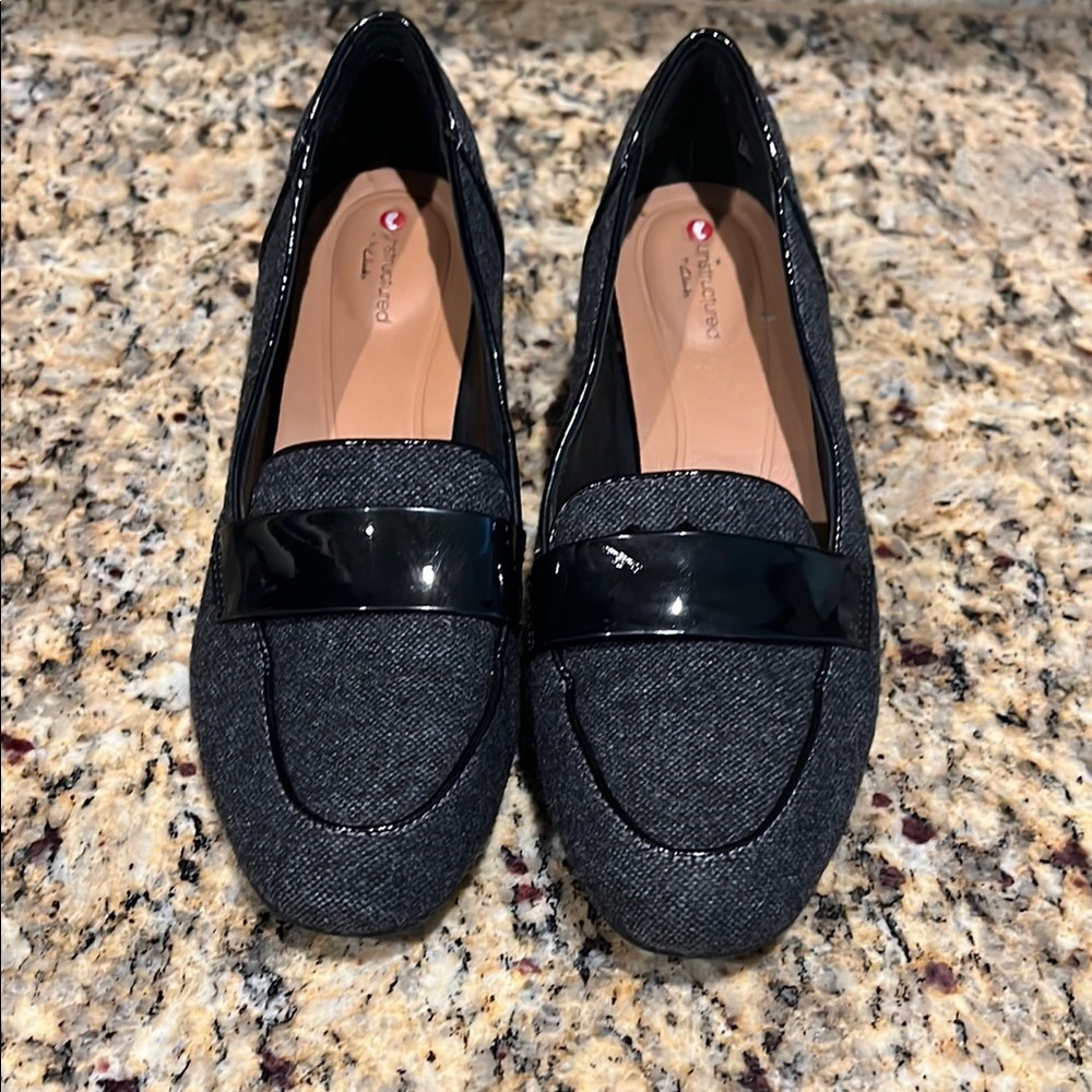 Unstructured by Clarks. Grey and black with patent leather heel.